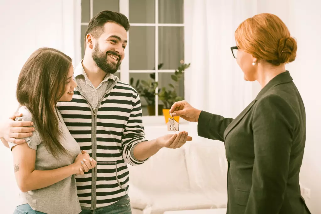 Buying New Apartment, Young Family Just Purchased New Apartment, Happy Man And Woman Receiving Keys For New Home